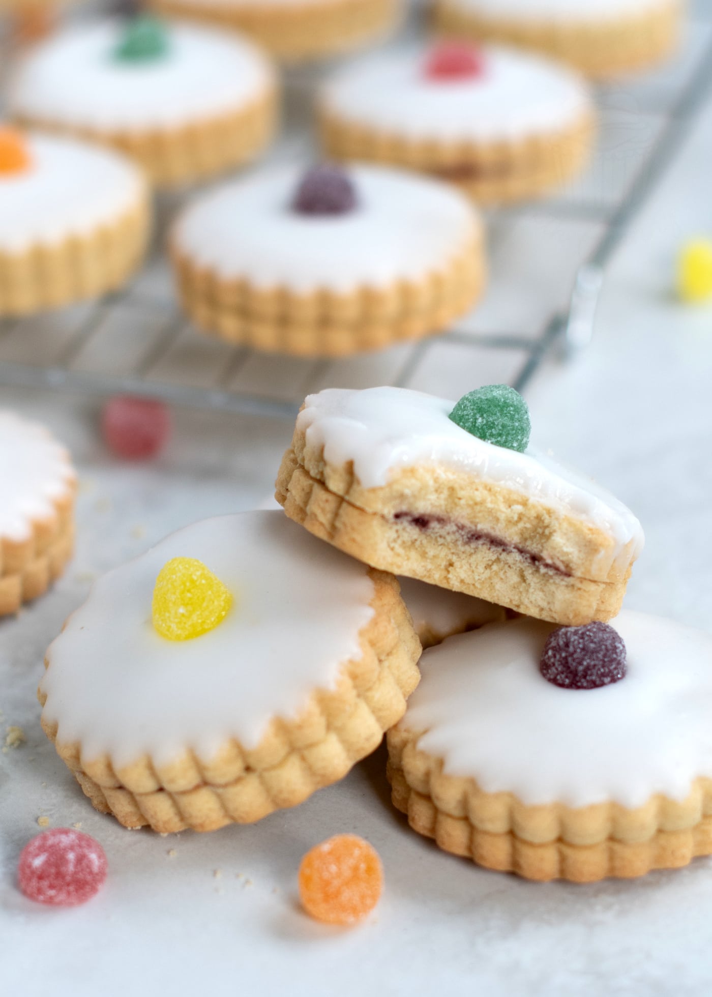 German Biscuits recipe from Baking with Granny. Classic Scottish biscuits, with jam, icing and a cherry top.