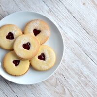 Jammy Dodgers recipe from Baking with Granny. Classic British biscuit. Melt-in-the-mouth, sandwiched with jam, and a little heart middle.