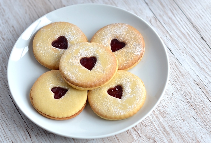 Jammy Dodger recipe from Baking with Granny. The perfect recipe for home made jammie dodgers. Delicious shortbread style biscuits, filled with strawberry jam and a little heart hole.