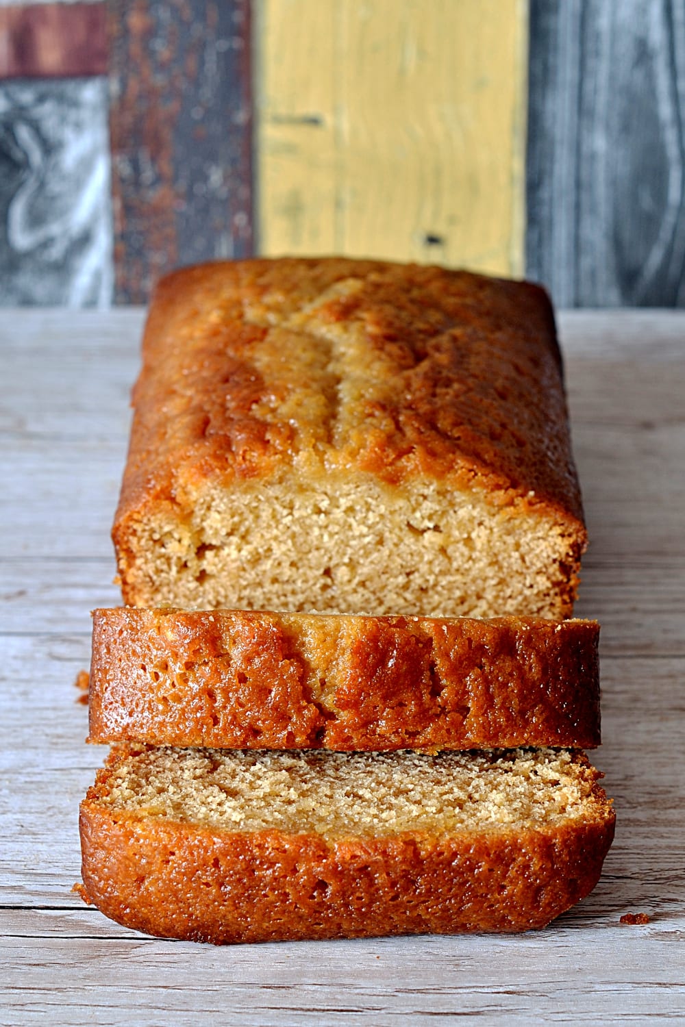 Golden Syrup Cake. Sweet and sticky golden syrup loaf cake, sliced to serve.