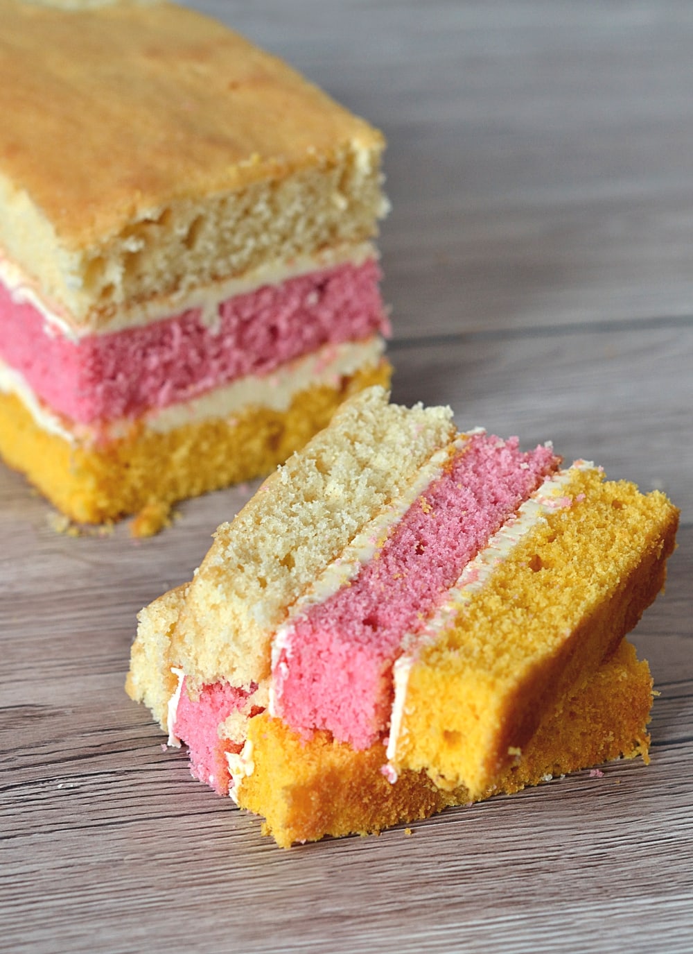 Angel Cake. The classic layer sponge loaf. Pink, yellow and plain, sandwiched together with buttercream.
