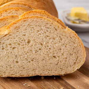 Close-up of sliced homemade white bread showing soft crumb texture.