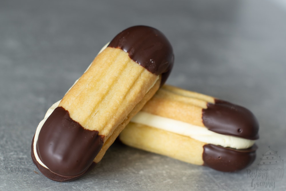 Recipe for easy Viennese biscuits. Buttery biscuits, dipped in chocolate and sandwiched with buttercream.