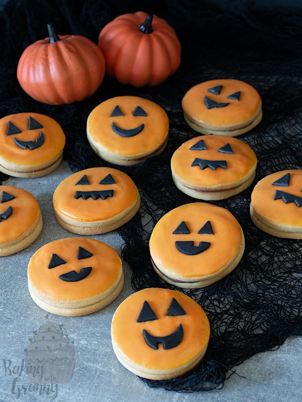 Pumpkin empire biscuits. Halloween iced cookies, with pumpkin faces.