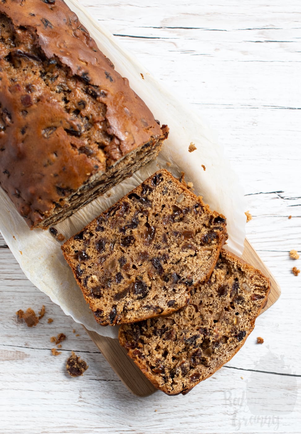 Sliced Bara Brith, showing the dried fruit inside the rich loaf.