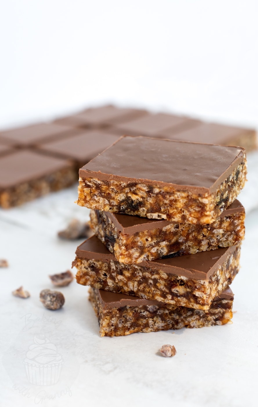 Stack of Krispy Date Slice squares with smooth chocolate top and chewy date filling with rice crispies.