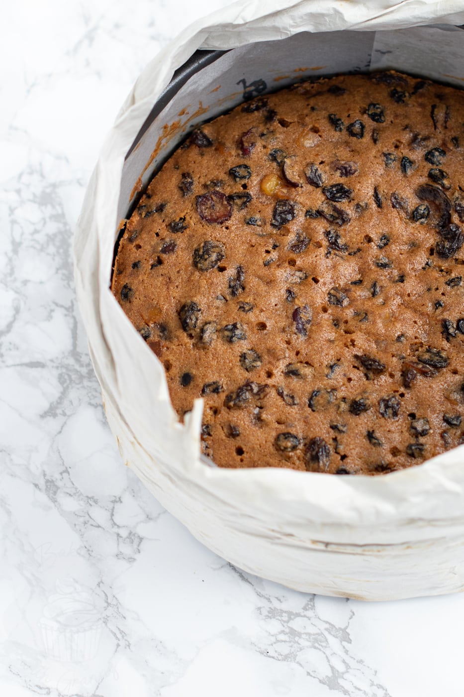 Christmas cake fresh from the oven, baked in an 8 inch round tin.