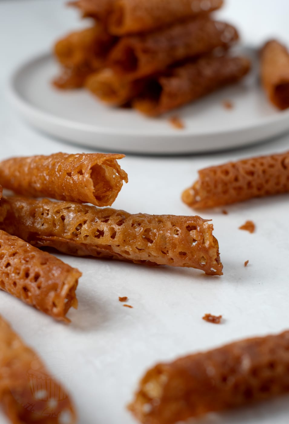 Brandy snaps. Easy recipe for brandy biscuits made with brown sugar, golden syrup and brandy.