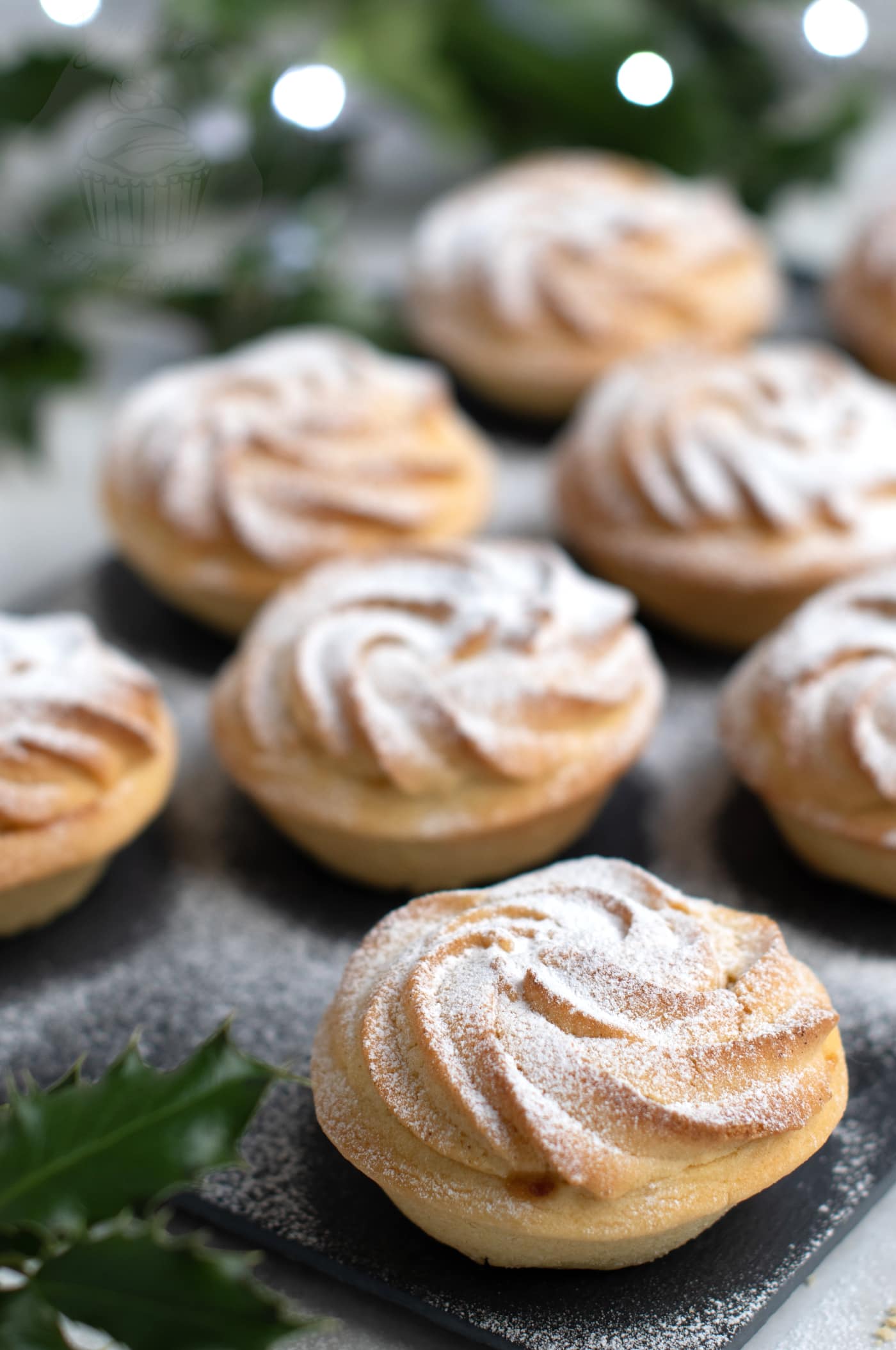 Festive mince pies, made with a Viennese whirl on top.