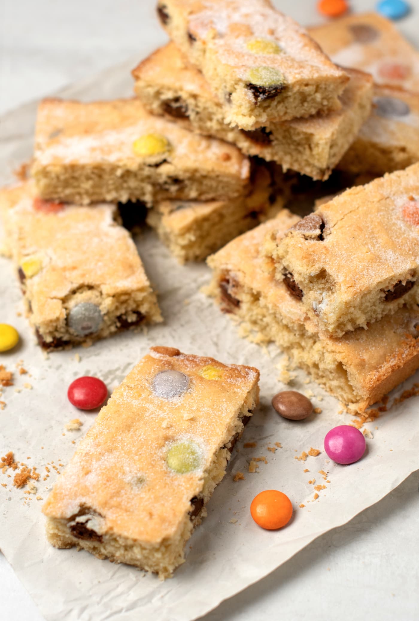 Polka Dot Slice recipe. Easy tray bake cake, perfect for baking with kids. Chocolate rainbow drops, with coconut and vanilla flavours.