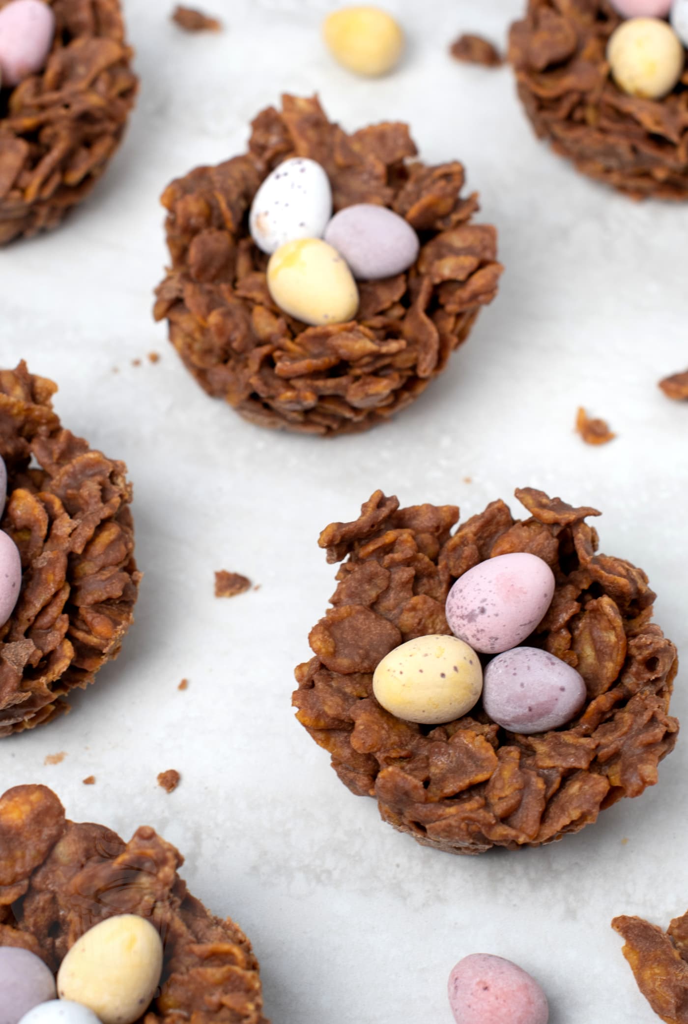 Homemade chocolate Easter nests with cornflakes and mini eggs.