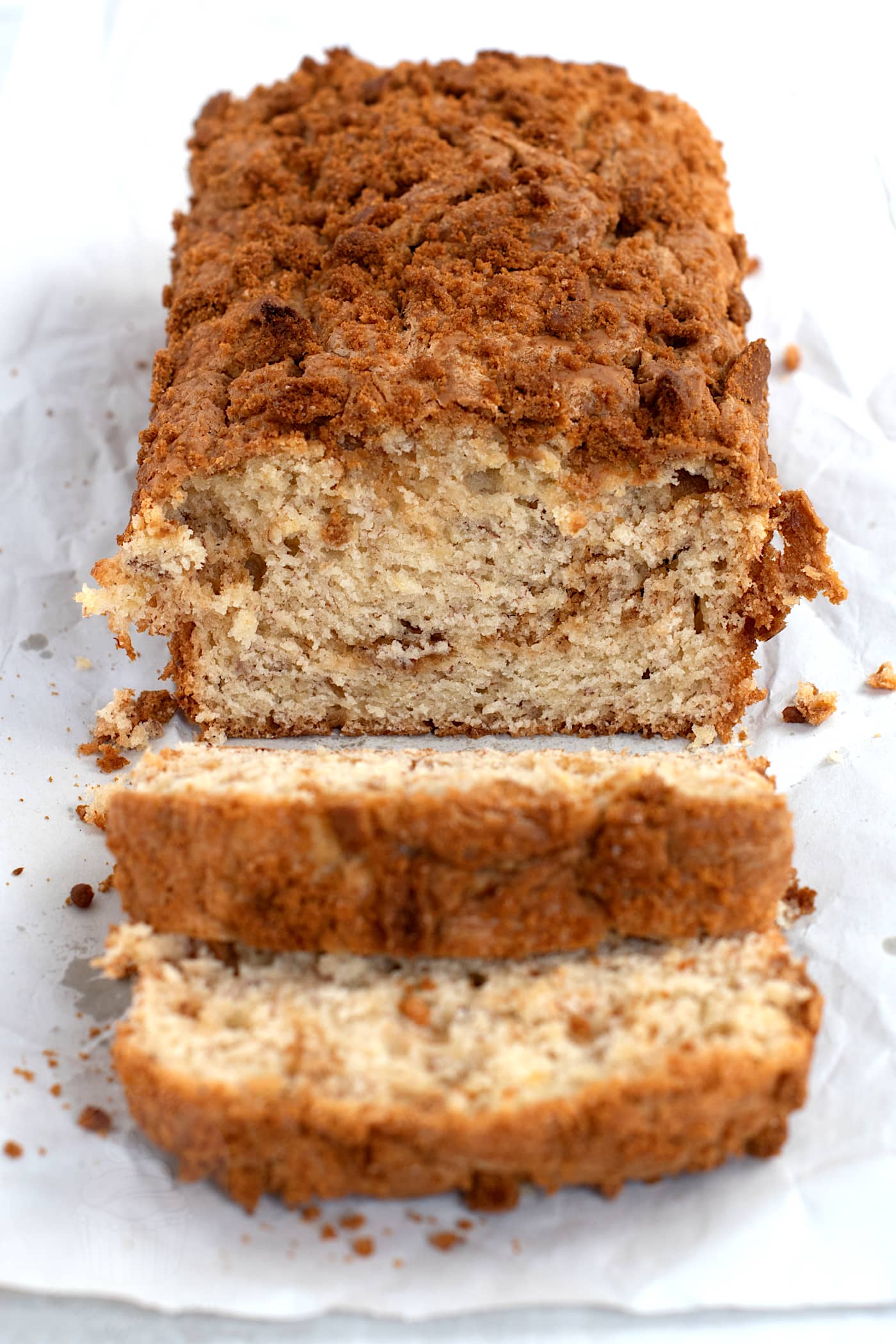 Banana Biscoff Bread, sliced to show the swirl of Biscoff spread that runs through the middle of the cake.