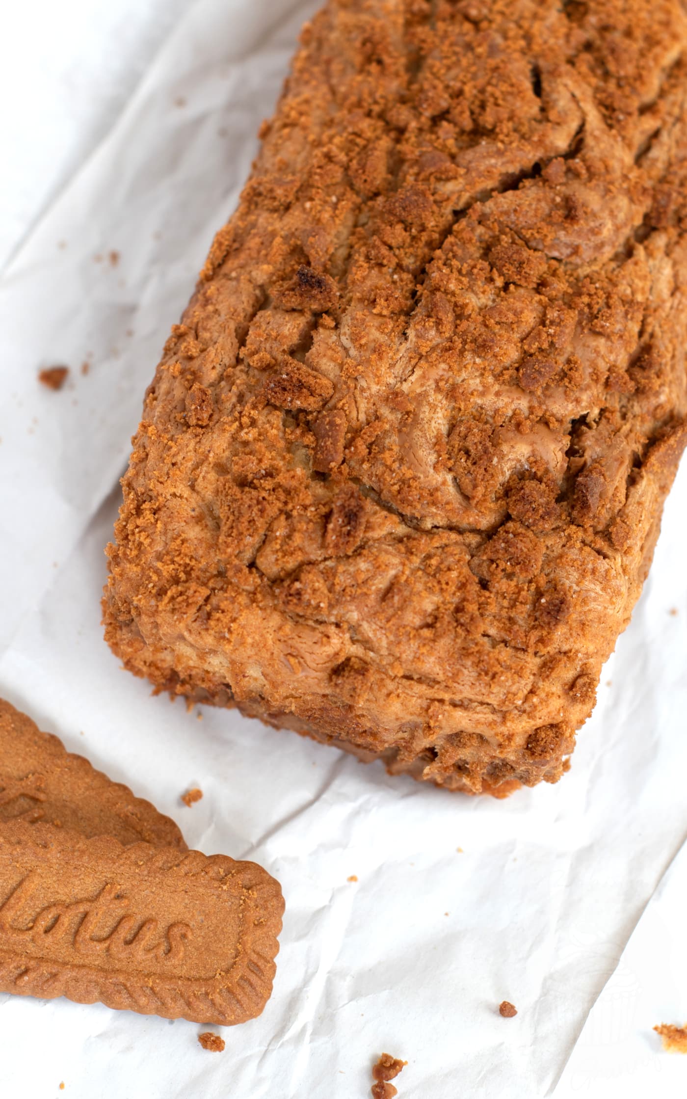 Biscoff Banana Loaf which is golden in colour, with crumbs of Biscoff biscuits scattered on top.