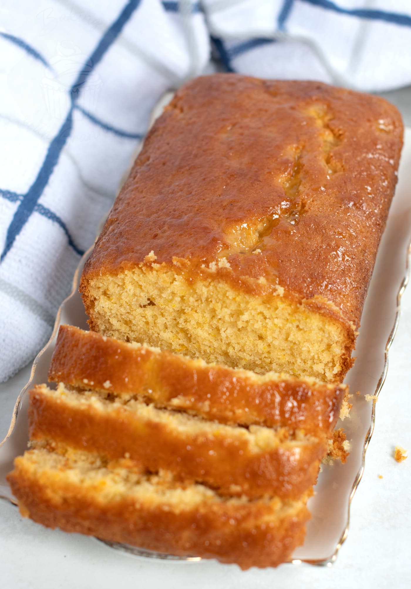 Sticky marmalade loaf cake, made to a traditional UK recipe, cut into individual slices.