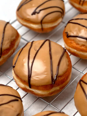 Scottish Fudge Donuts recipe from Baking with Granny. Yeast donuts, filled with custard, topped with homemade fudge icing.