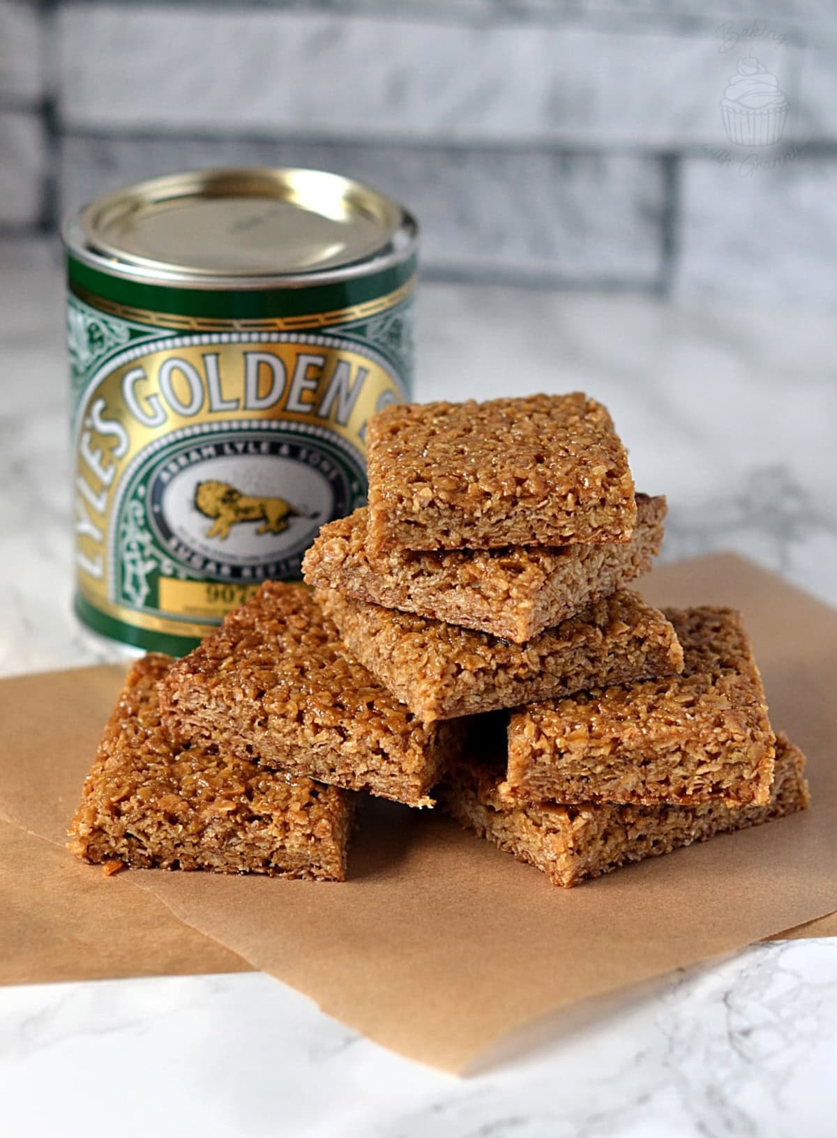 Chewy flapjack, sat in front of a tin of Golden Syrup.