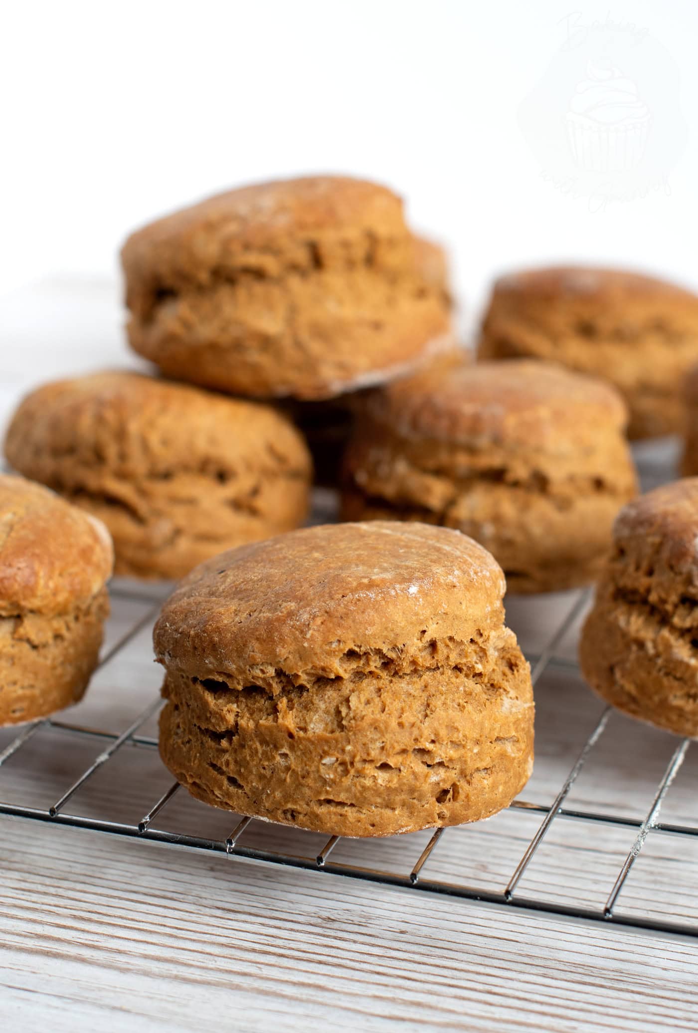 Homemade treacle scones cooling on a wire rack after baking.