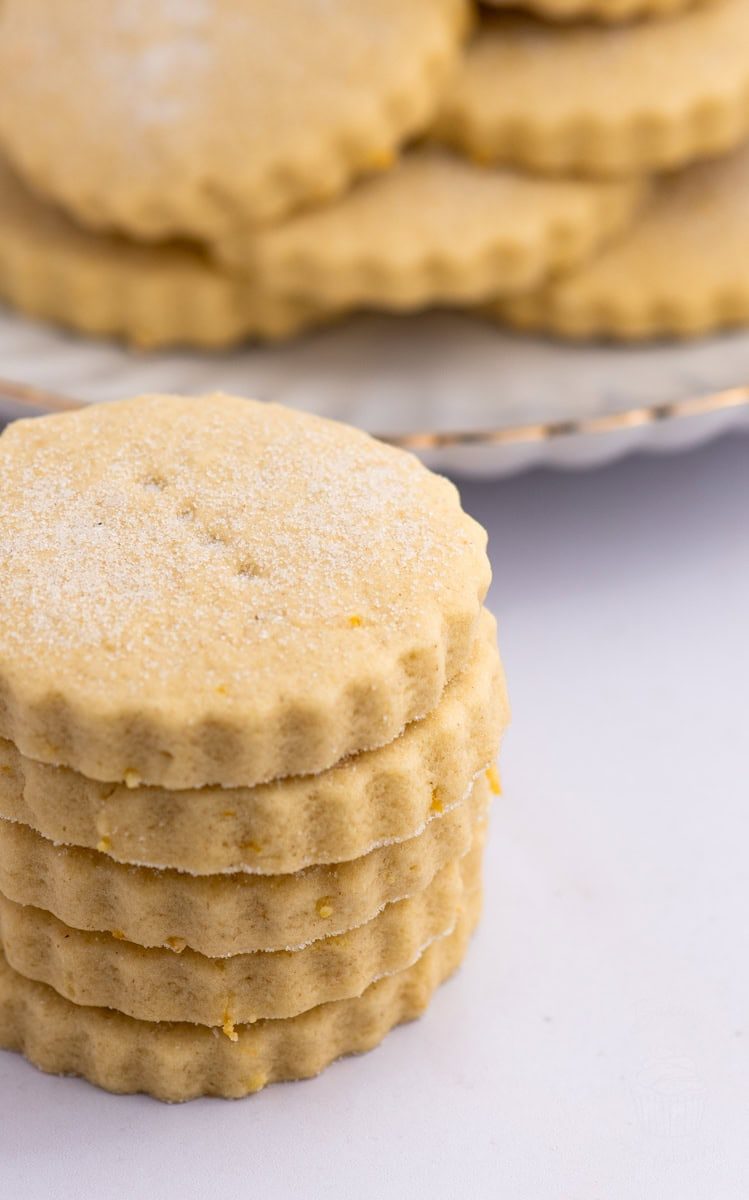 Close-up stack of Tantallon Cakes, traditional Scottish lemon biscuits with sugar on top.