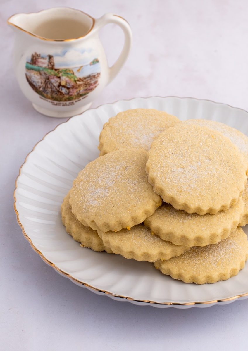Plate of traditional Scottish Tantallon Cakes biscuits dusted with sugar.
